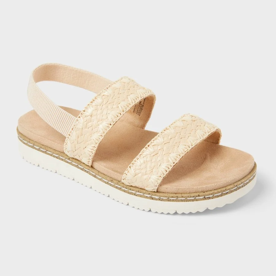 Tan kids' Kailan footbed sandals with wide cross straps on a white background