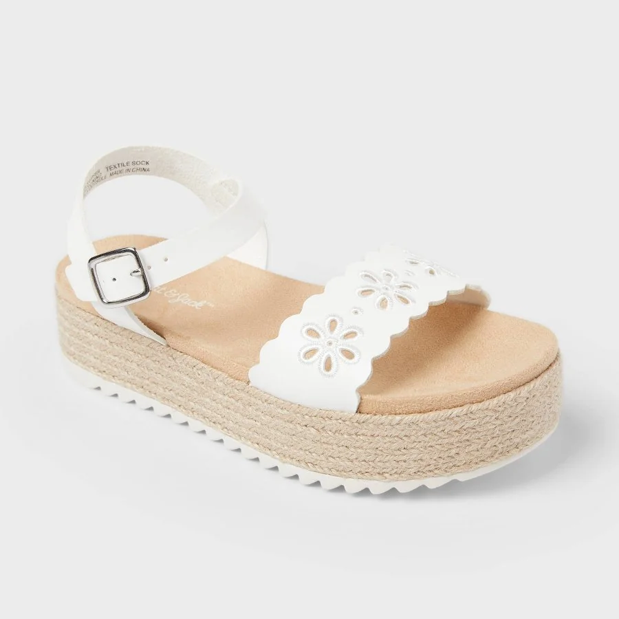 White kids' Lindsey casual sandals with ankle strap and toe loop on a white background
