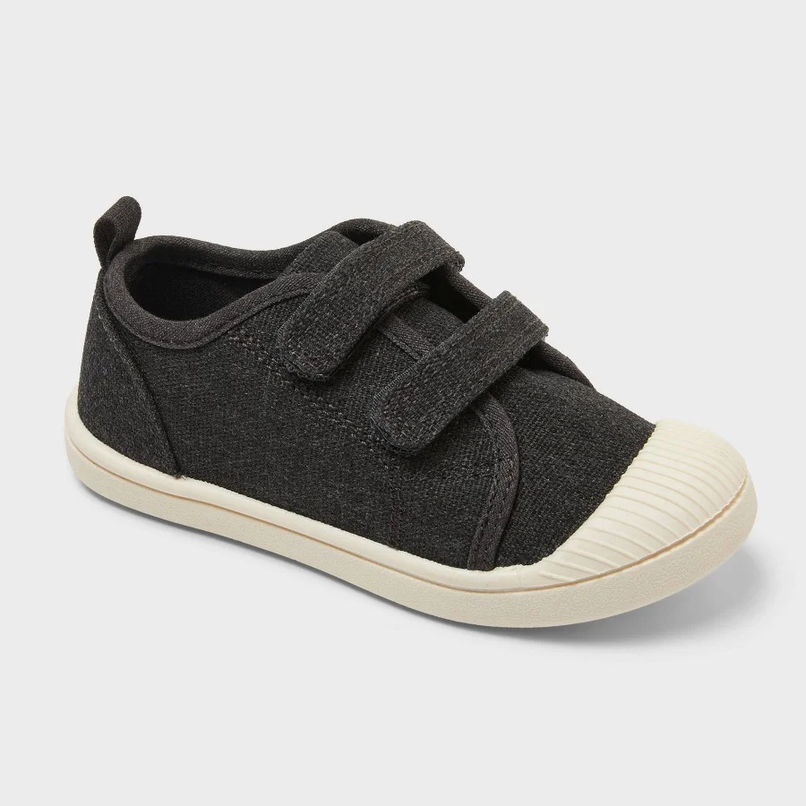 Navy blue toddler canvas sneakers with double hook-and-loop straps and white toe cap on a white background